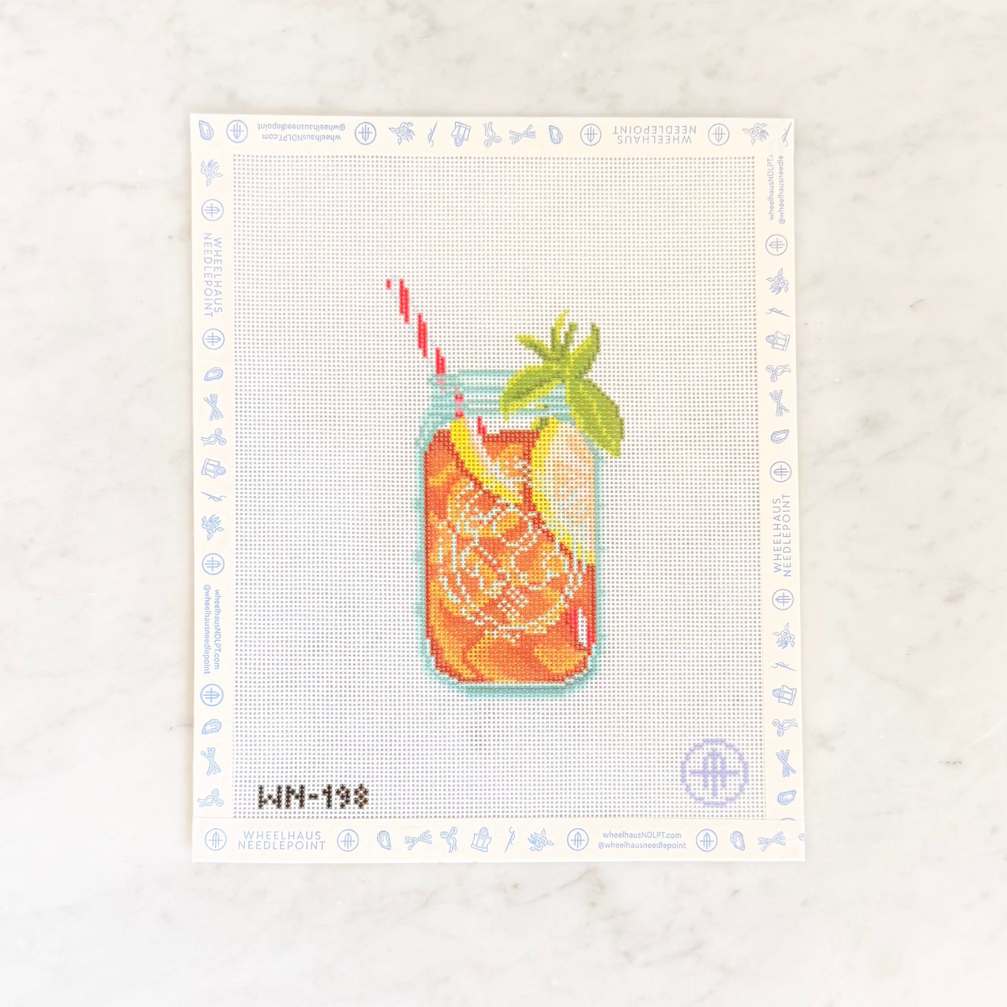 Needlepoint design of a sweet iced tea in a canning jar with a straw on a white background.
