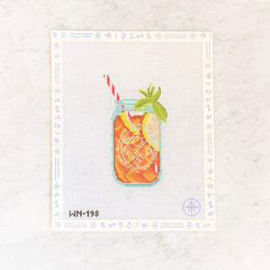 Needlepoint design of a sweet iced tea in a canning jar with a straw on a white background.