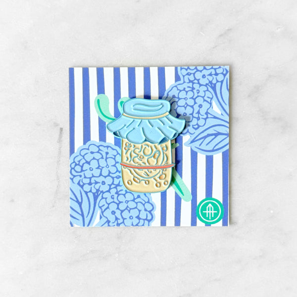 Decorative item with a blue and white striped pattern on a white background